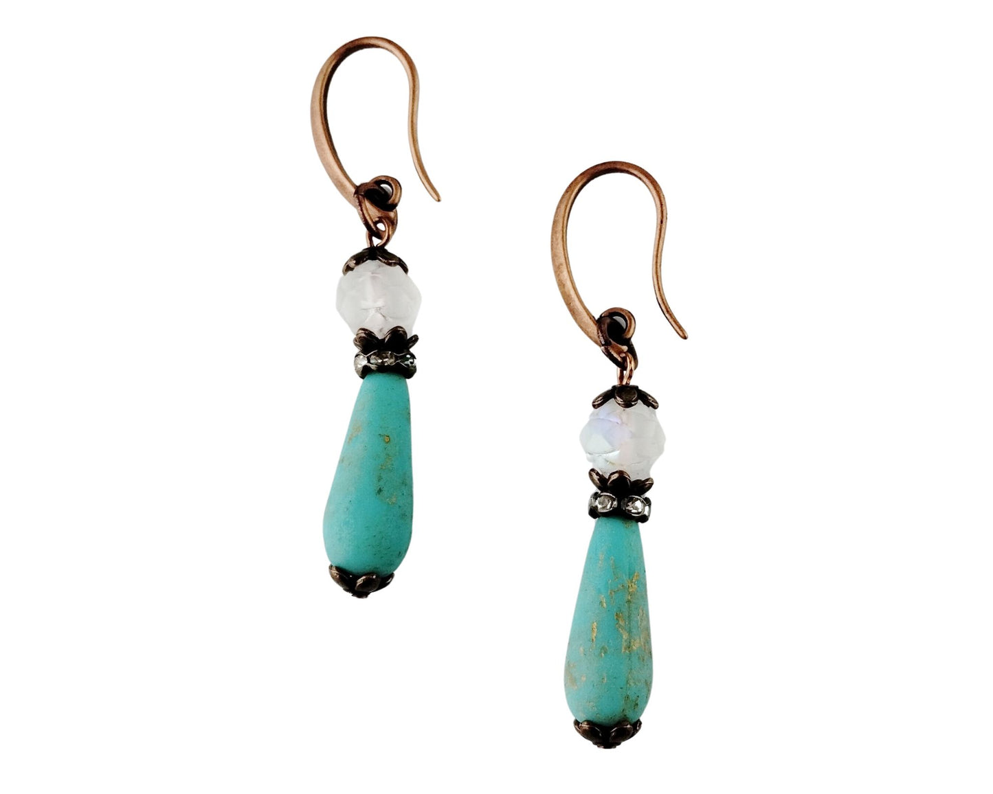 Handcrafted Moonlit Waves Earrings with peacock blue glass teardrops.