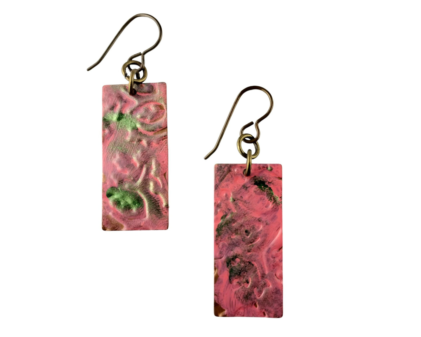 Handmade brass earrings with embossed floral design in coral pink and green