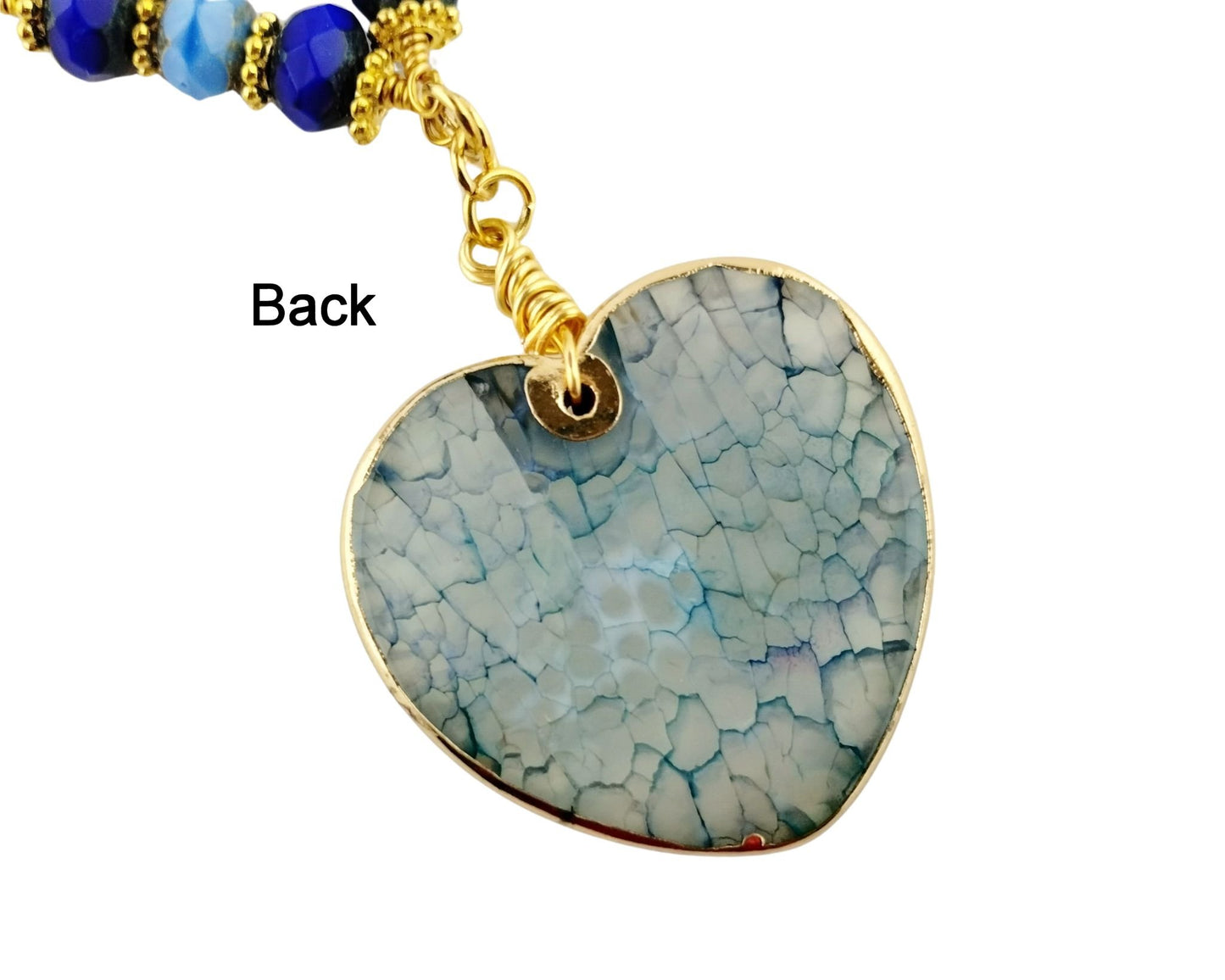 Elegant blue gemstone jewelry set with glass pearls, floral bead detail, and bow tie connectors.