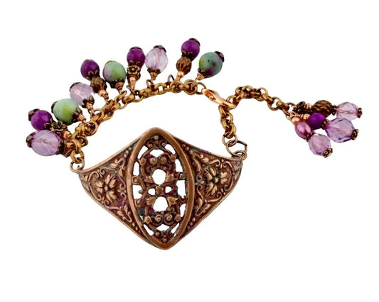 Handmade vintage filigree bracelet with plum purple and sea green beads.