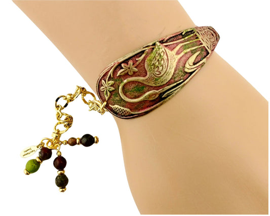 Handmade heron bracelet with painted brass bird focal and burgundy beads