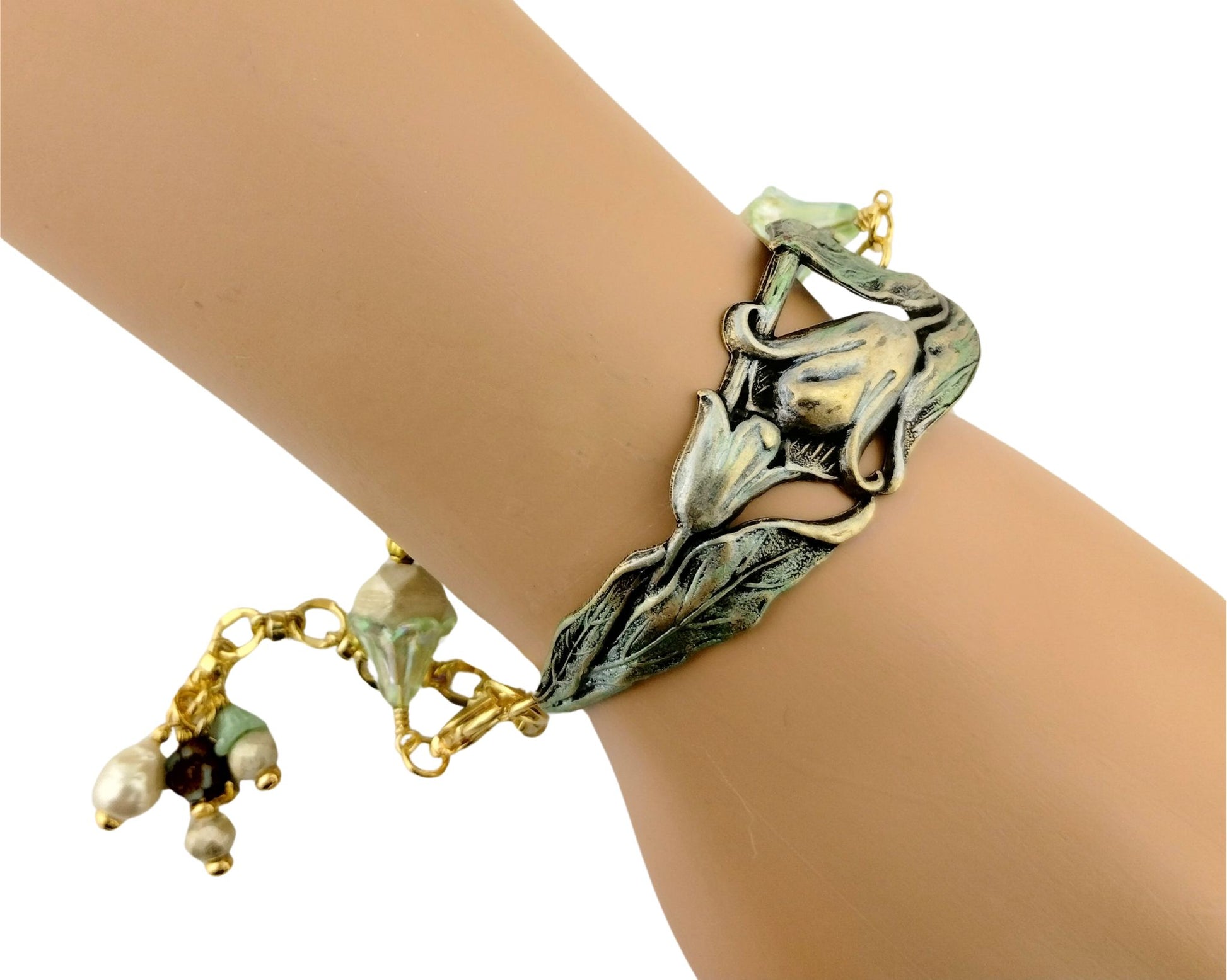 Handmade lily flower bracelet with mint green and cream beaded chain.