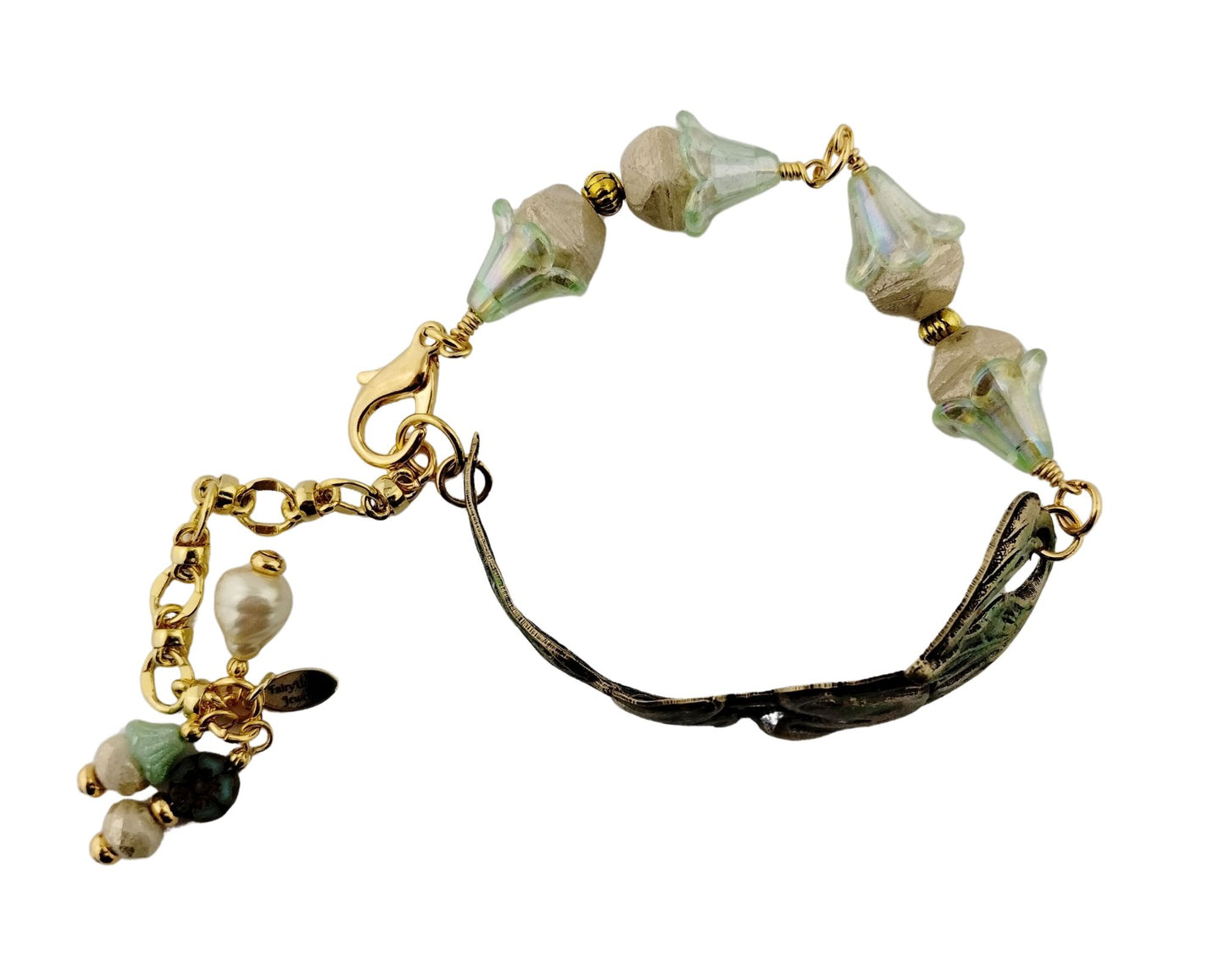 Adjustable handmade bracelet with vintage floral detail.