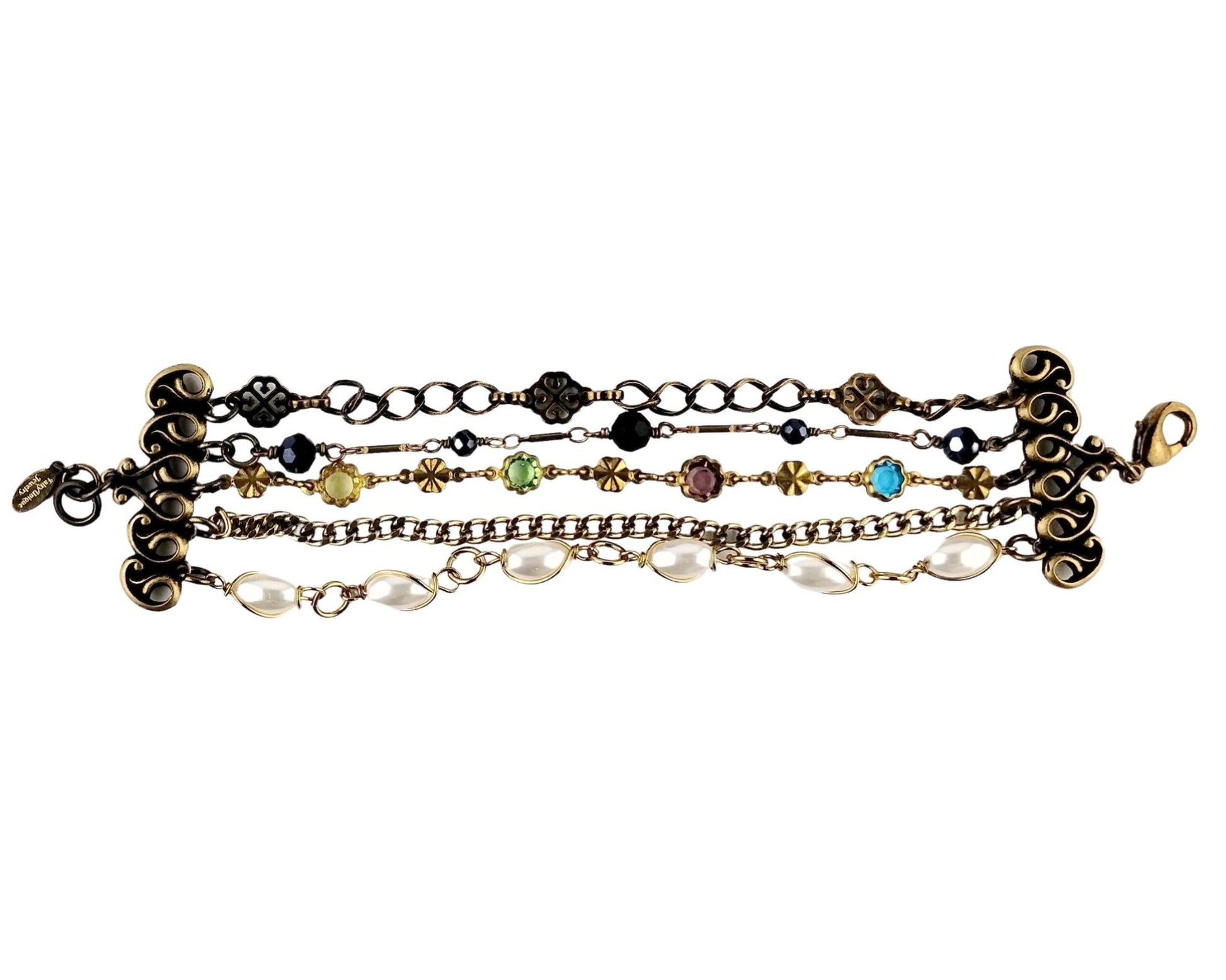 Layered bracelet with five unique chains and brass connectors