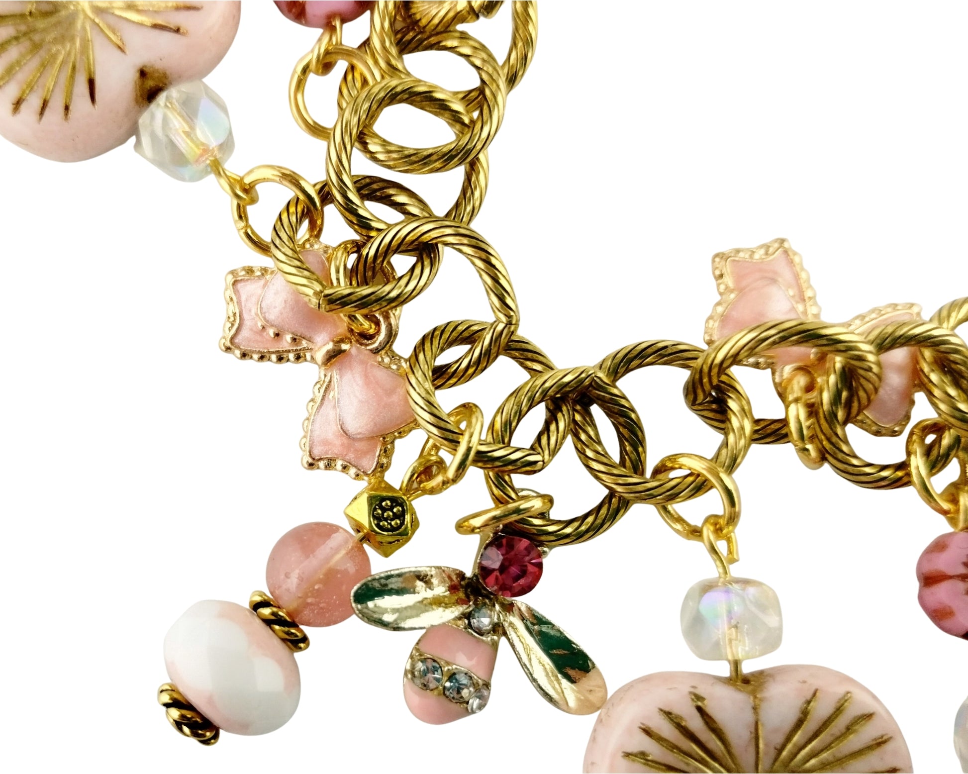 Gold chain bracelet with pink beads and charms on a white background