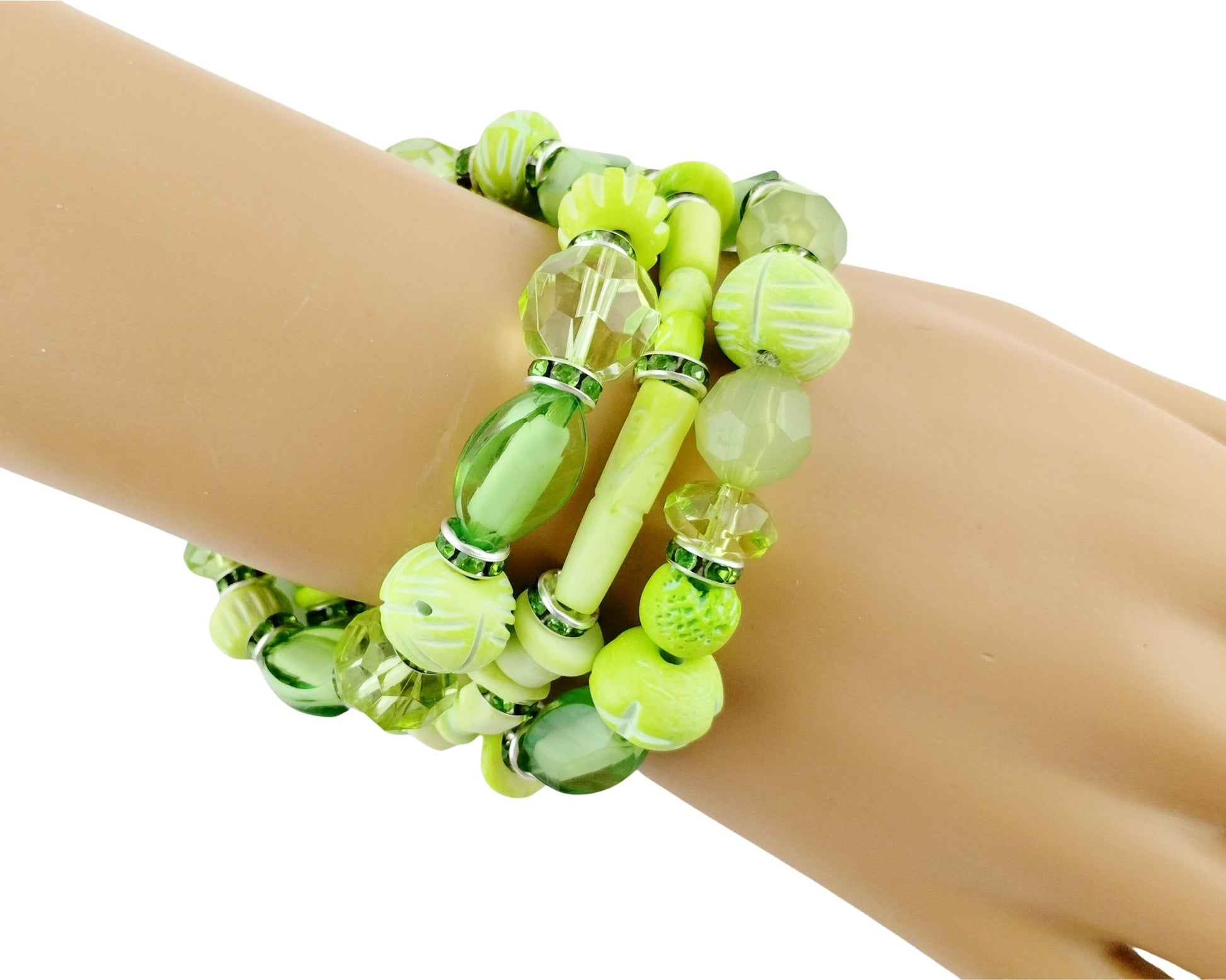 Green beaded bracelet on a mannequin wrist with a white background