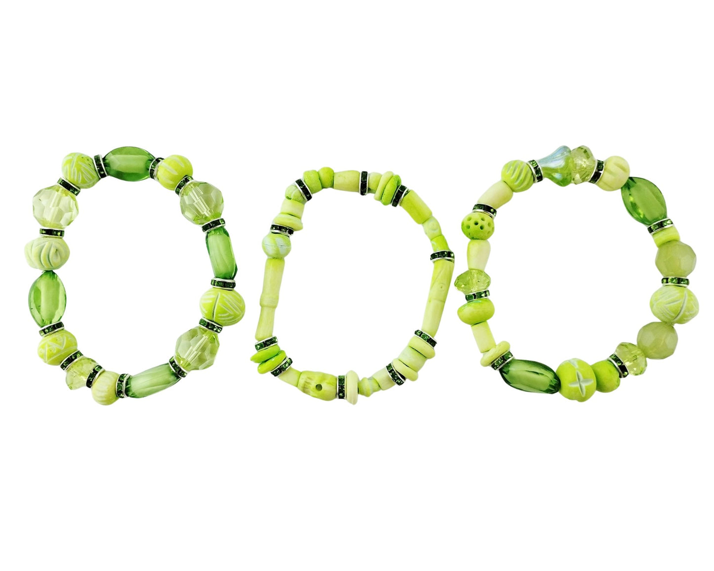 Three green beaded bracelets on a white background