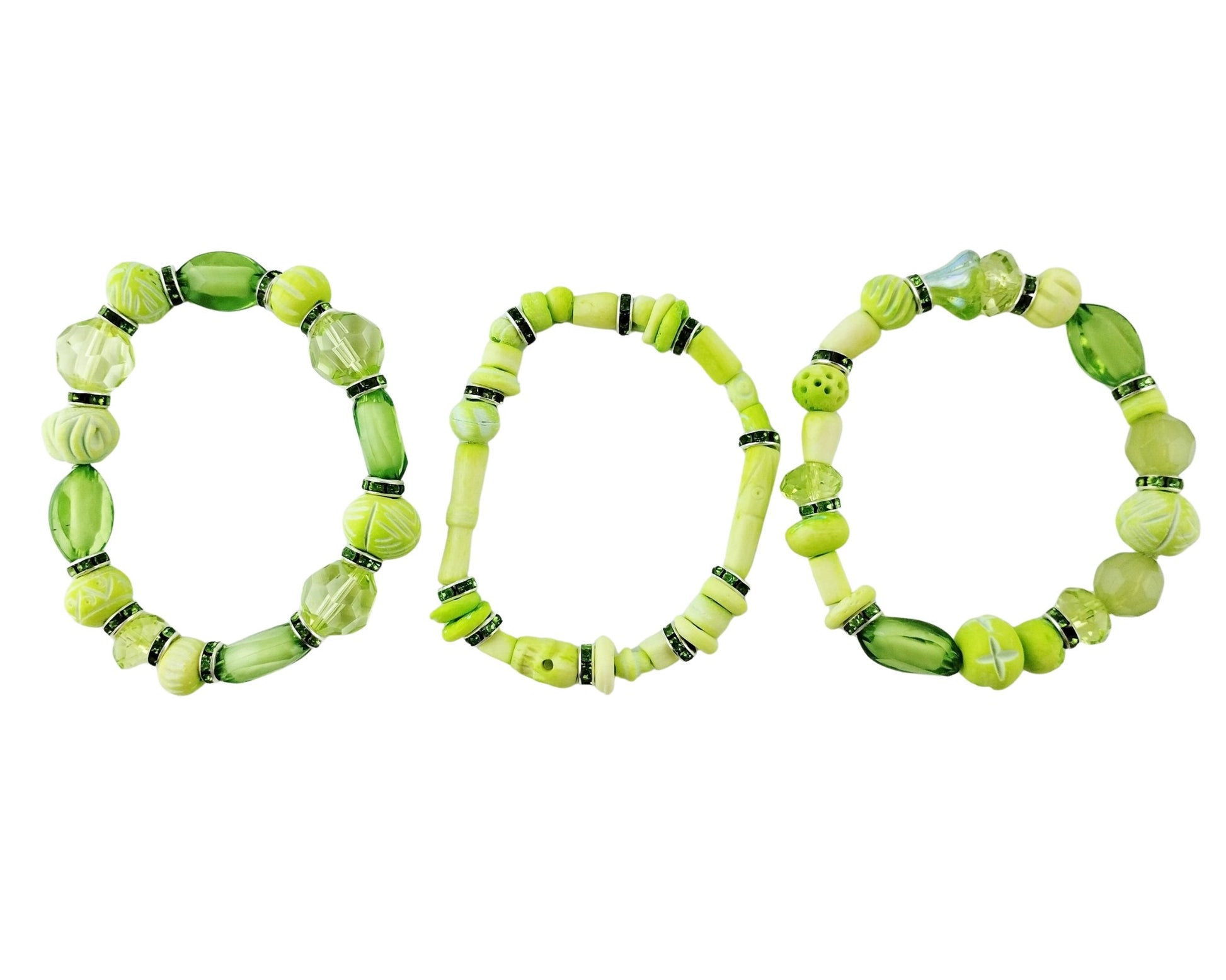 Three green beaded bracelets on a white background