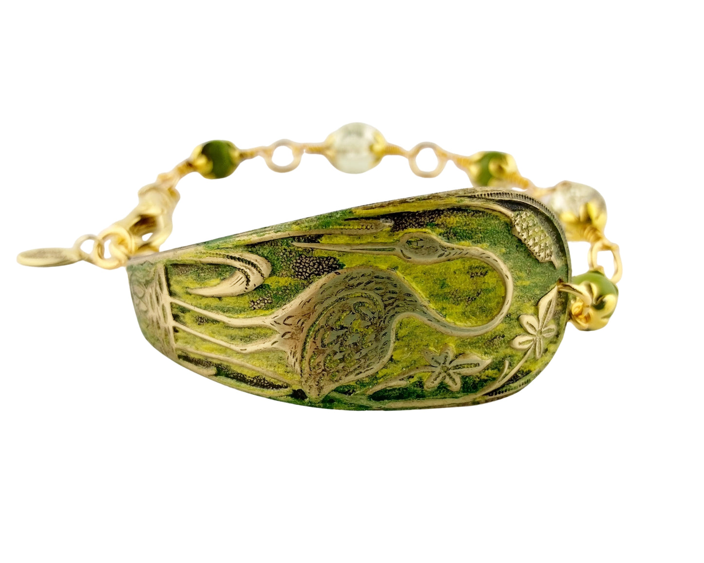 Bracelet with green stone and gold accents on a white background