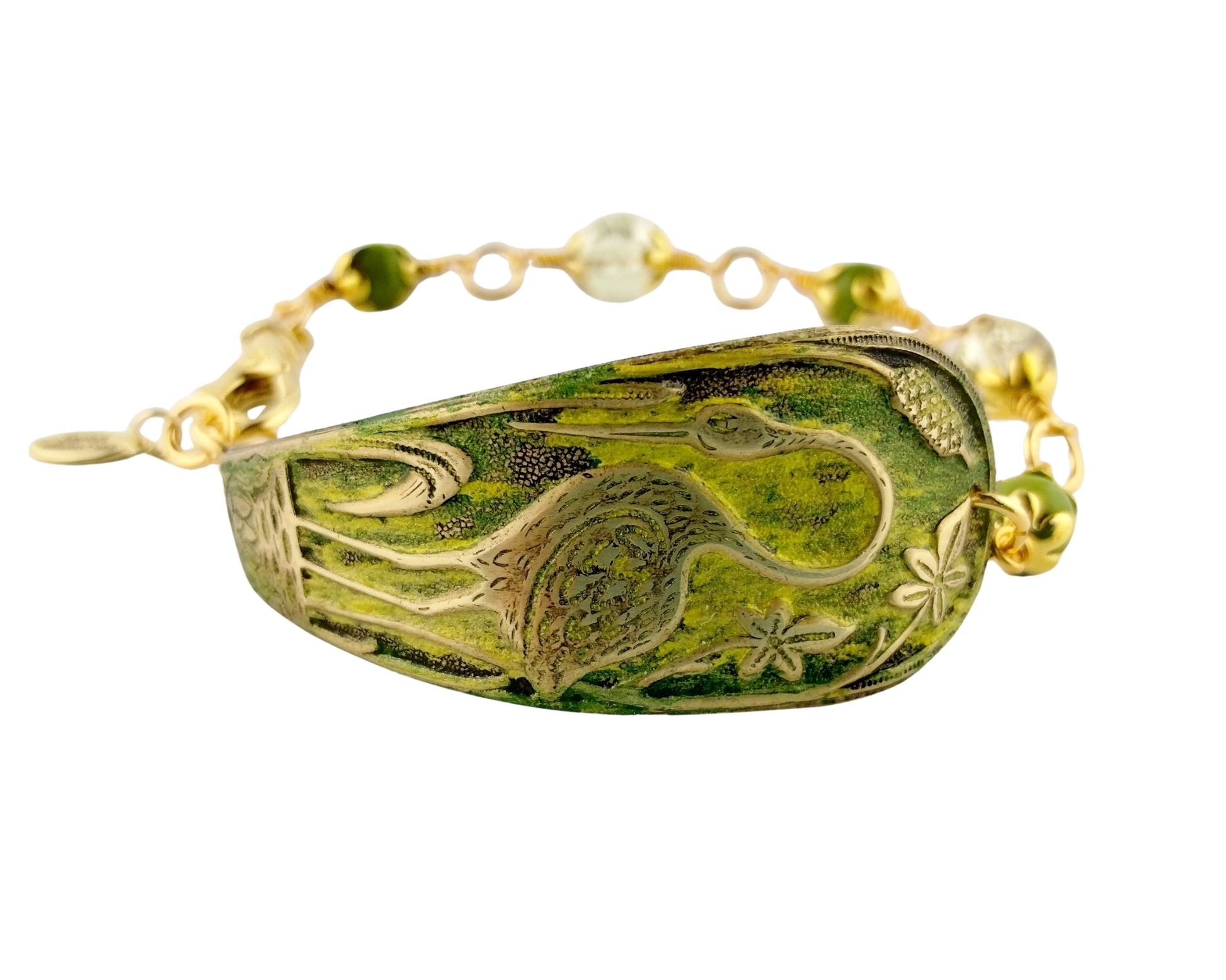 Bracelet with green stone and gold accents on a white background