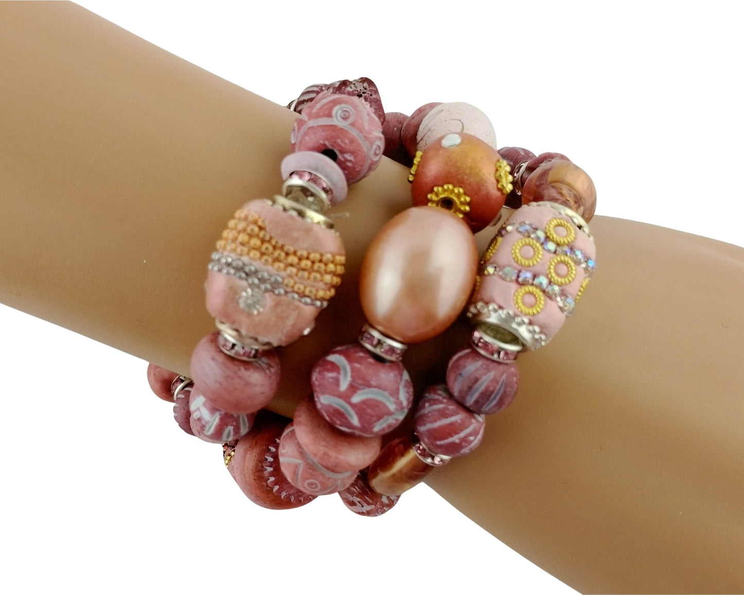 Multicolored beaded bracelet on a wrist against a white background