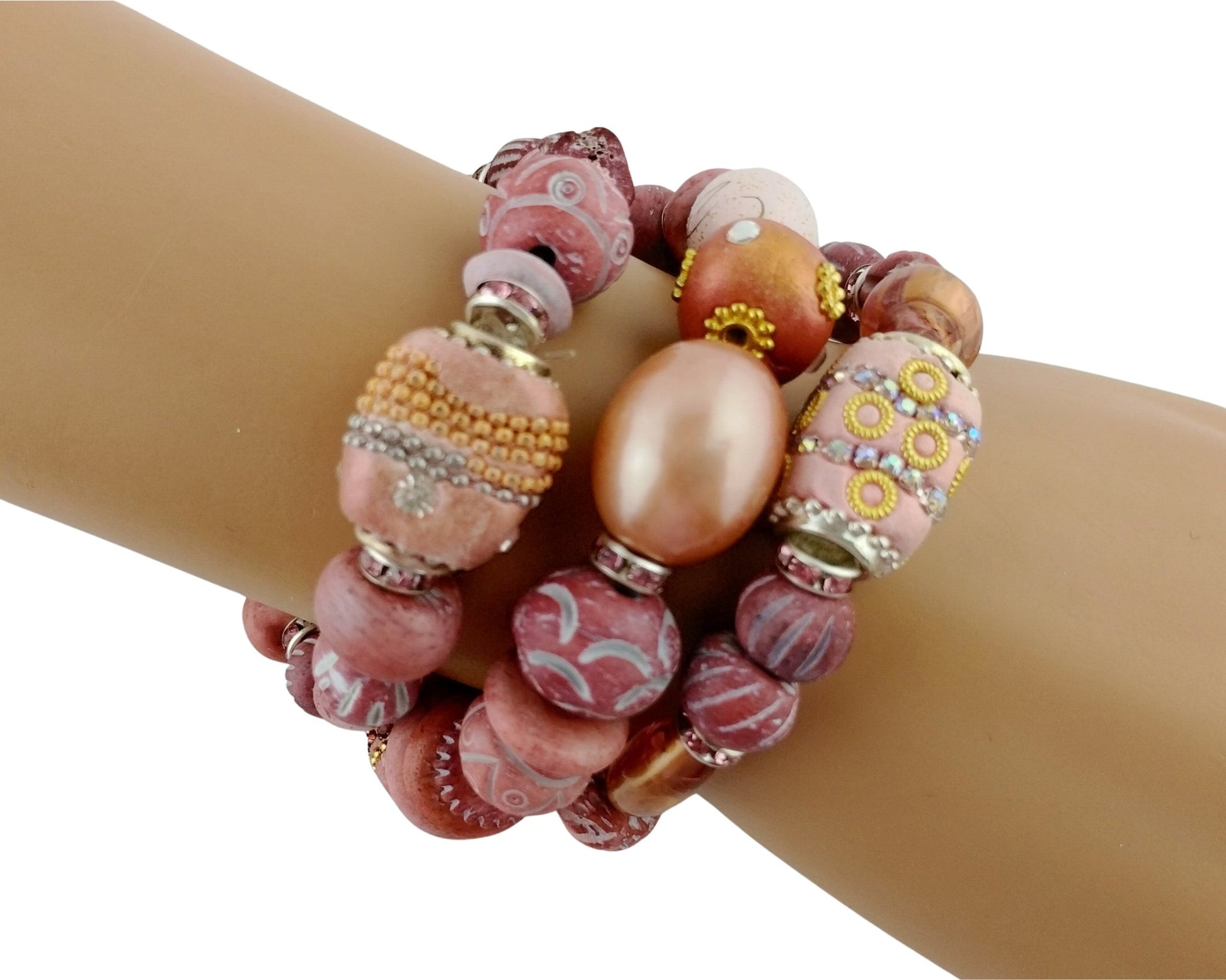 Multicolored beaded bracelet on a wrist against a white background