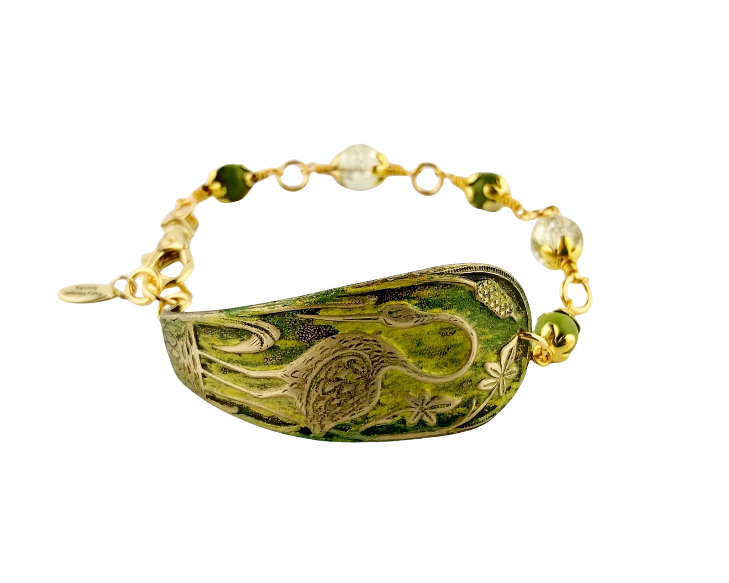 Bracelet with green decorative element and gold accents on a white background