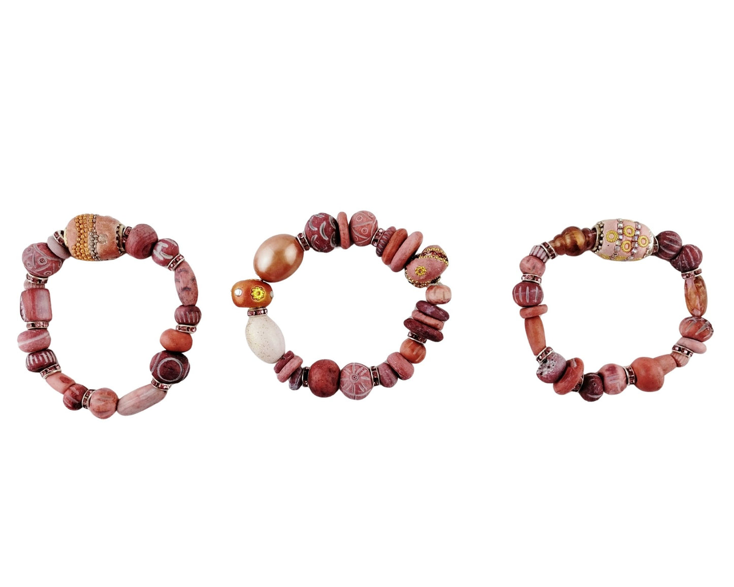 Three beaded bracelets on a white background