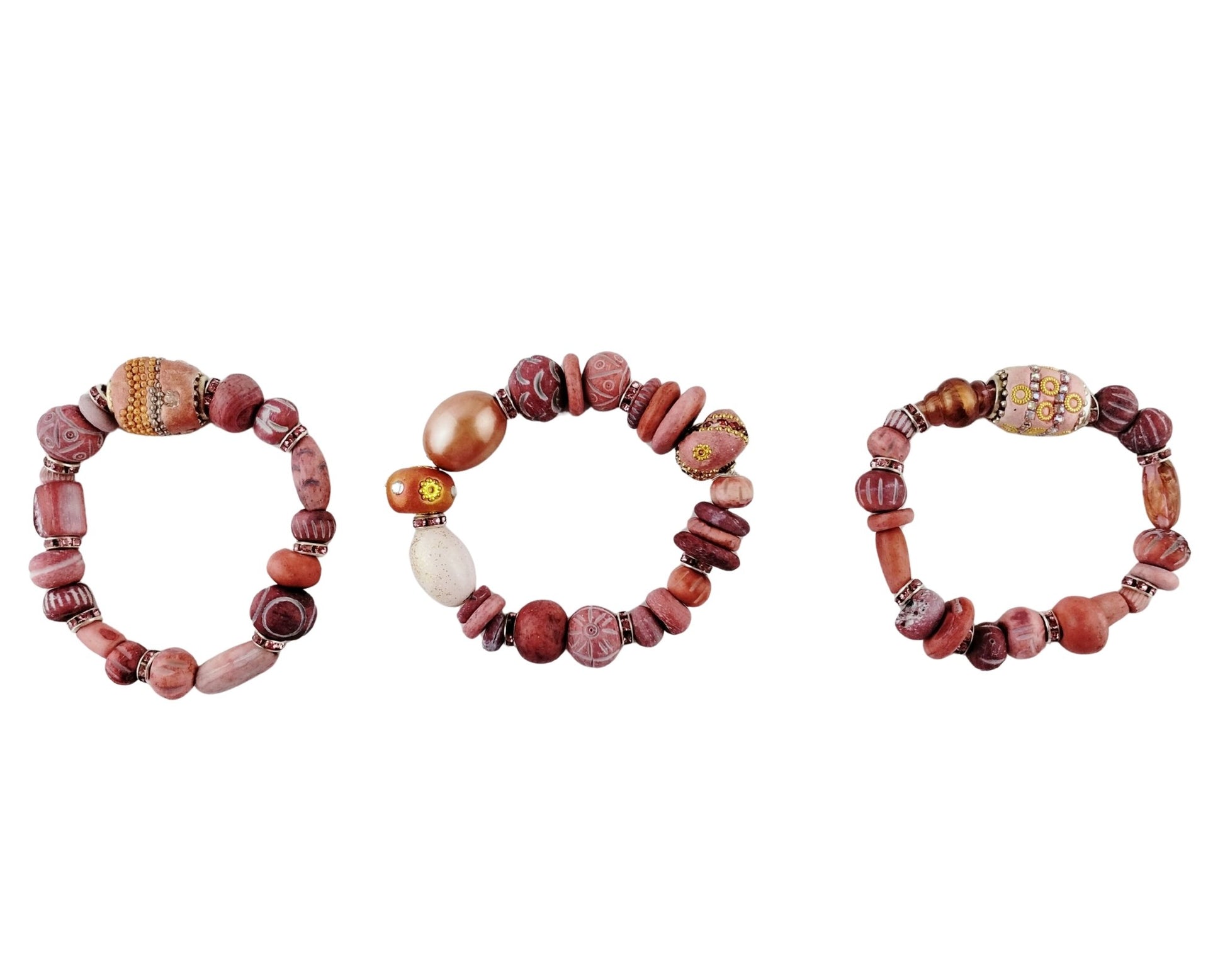 Three beaded bracelets on a white background
