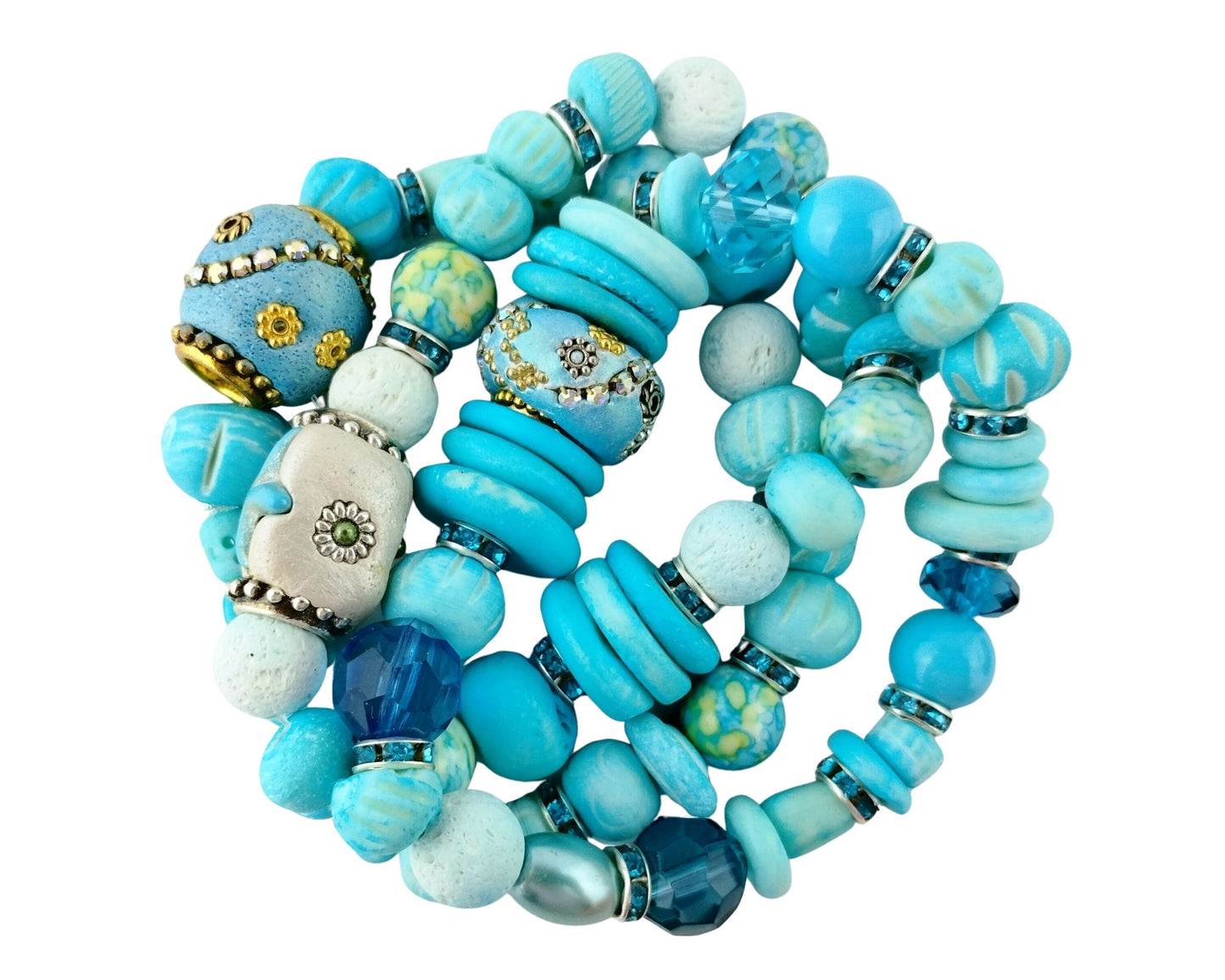 Set of blue beaded bracelets on a white background