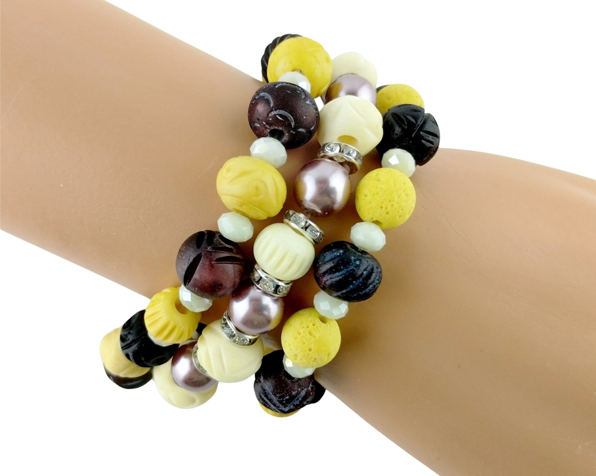 Multicolored beaded bracelet on a wrist against a white background
