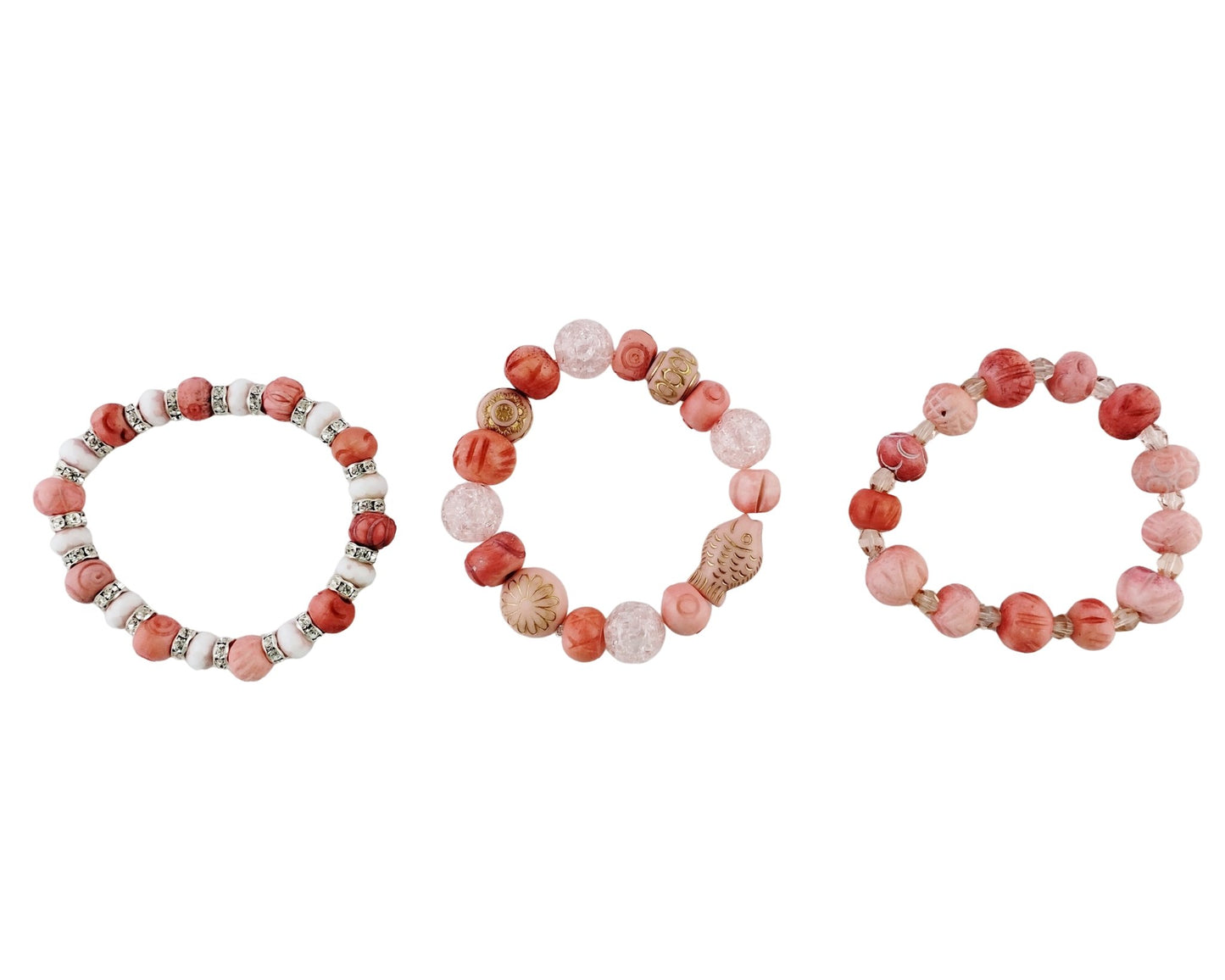 Three beaded stretch bracelets arranged side by side on a plain white background. The bracelets feature round beads in shades of coral pink, terracotta red, and light beige, accented with small metallic silver spacer beads.