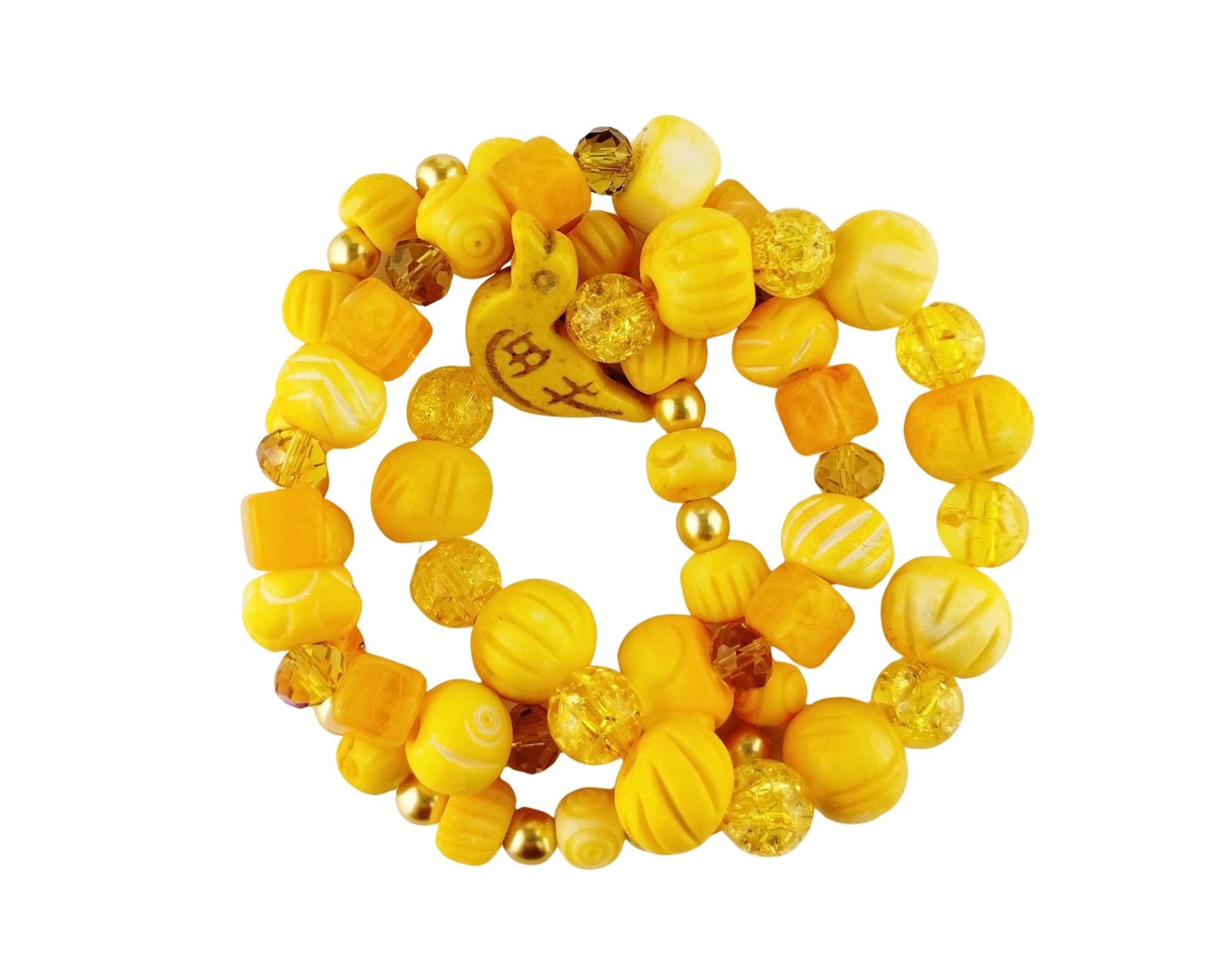 A sunny golden yellow stretch bracelet set with a howlite bird bead focal, glass beads and hand dyed bone beads.