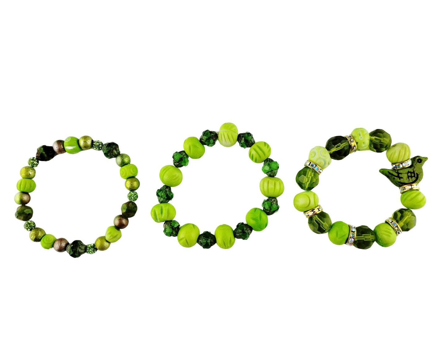 Three beaded stretch bracelets arranged side by side on a plain white background. The bracelets feature various shades of green, including lime green, forest green, and dark green, with some metallic bronze and silver accents.