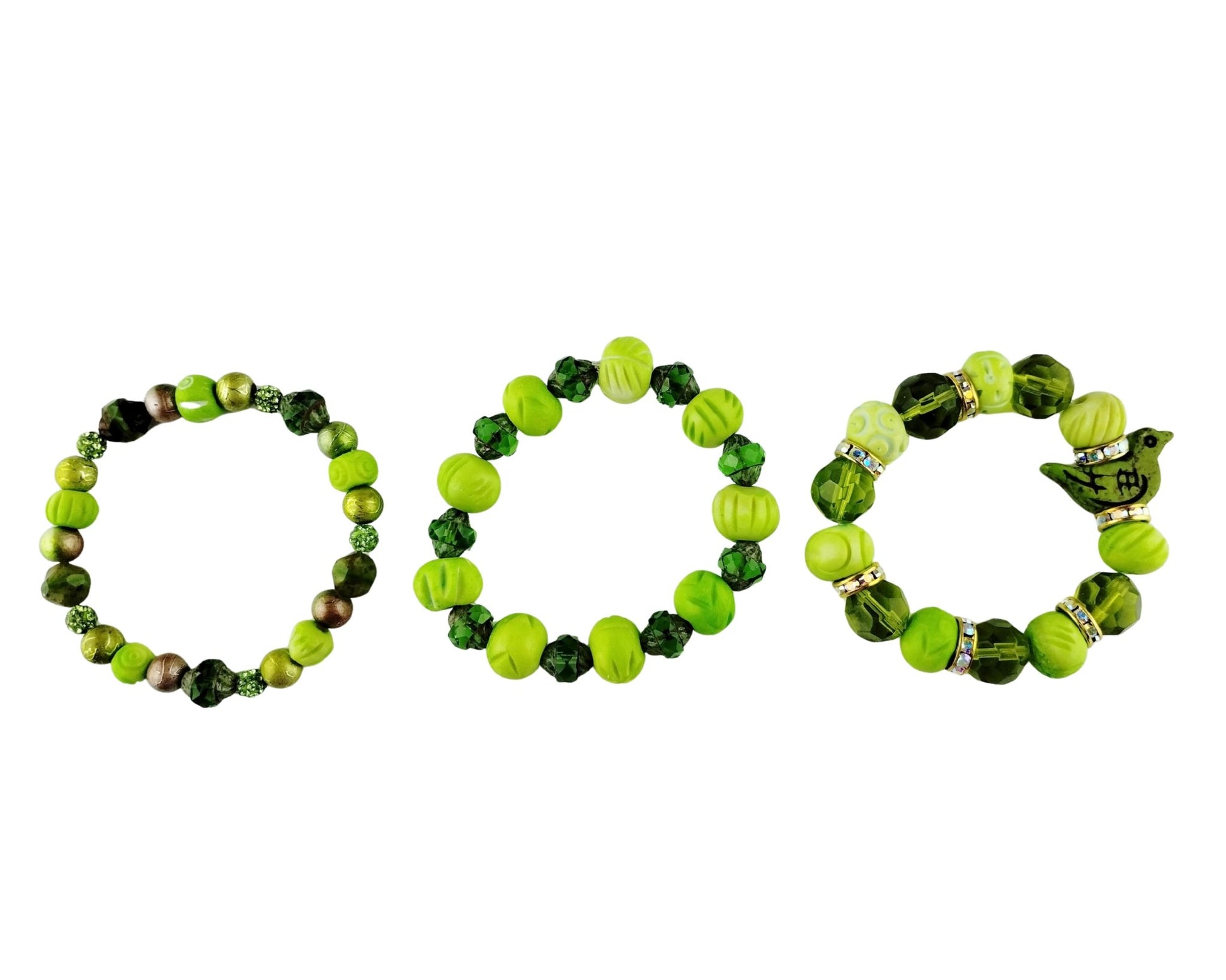 Three beaded stretch bracelets arranged side by side on a plain white background. The bracelets feature various shades of green, including lime green, forest green, and dark green, with some metallic bronze and silver accents.
