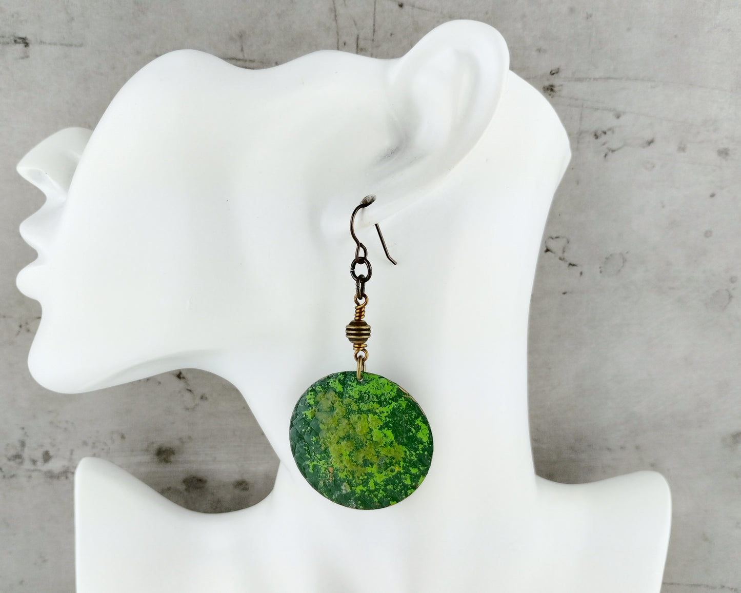 Elegant green earrings in dark and kelly tones with hand-painted brass and a statement drop design.