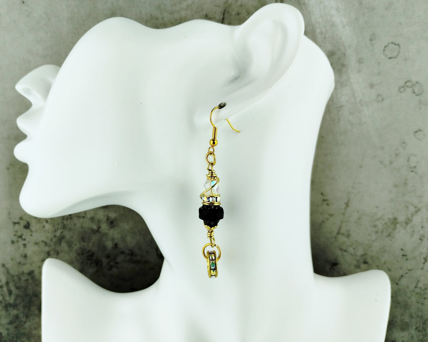Gold-plated drop earrings with jet black and rhinestone sparkle

