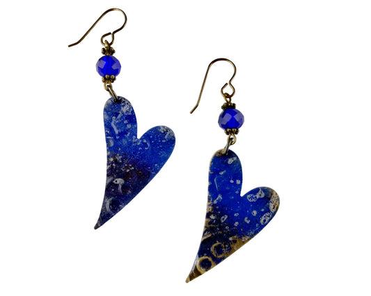 Boho artisan heart earrings in cobalt blue on white background