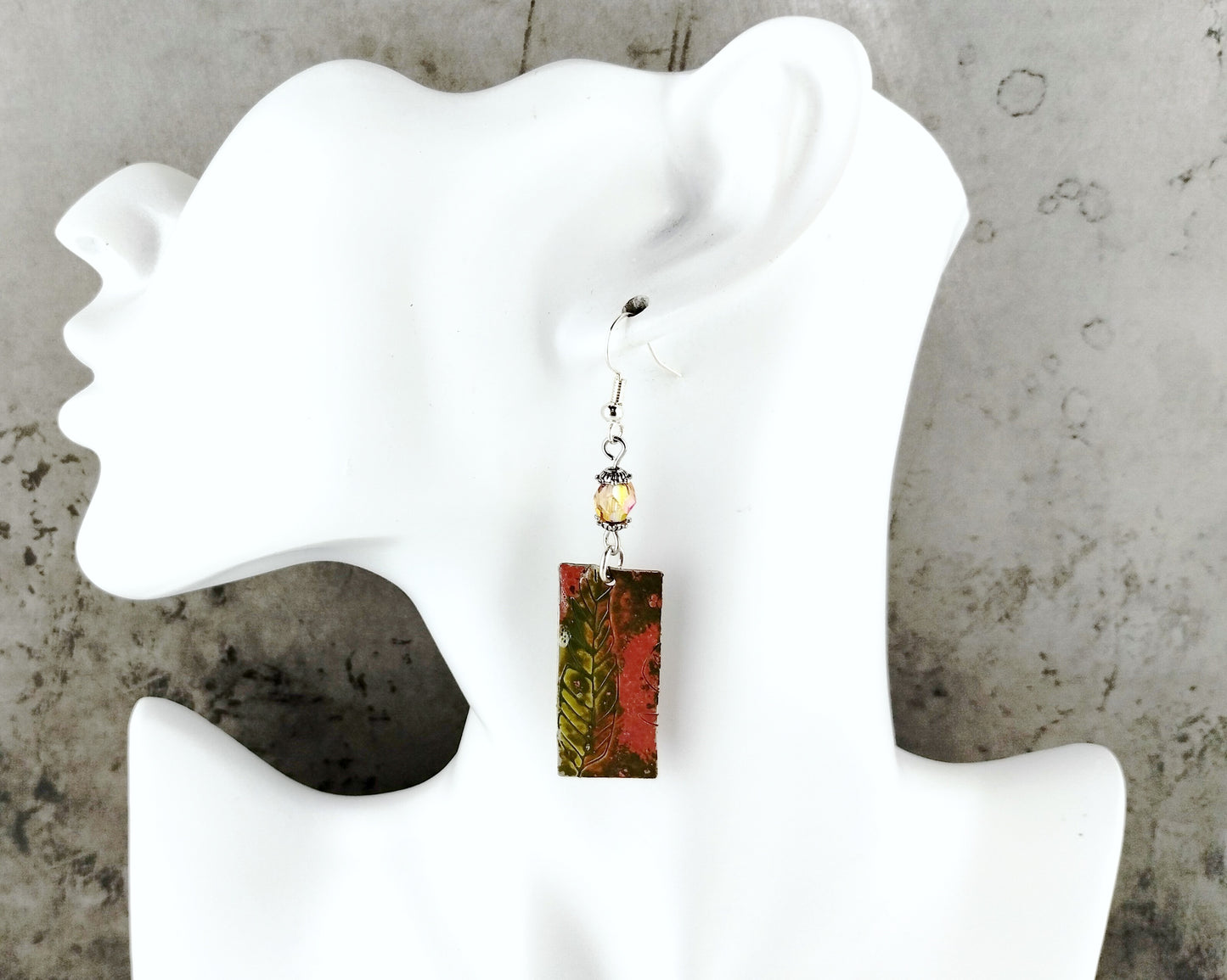 Rustic-style nature earrings featuring silver-plated brass findings and olive green painted charms