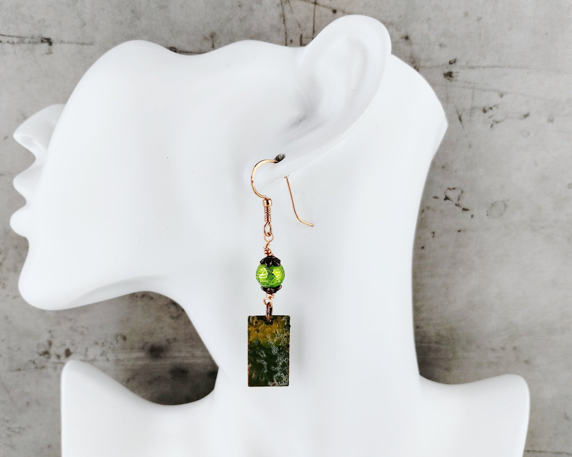 Rustic forest-themed earrings with textured copper blanks and green bead accents