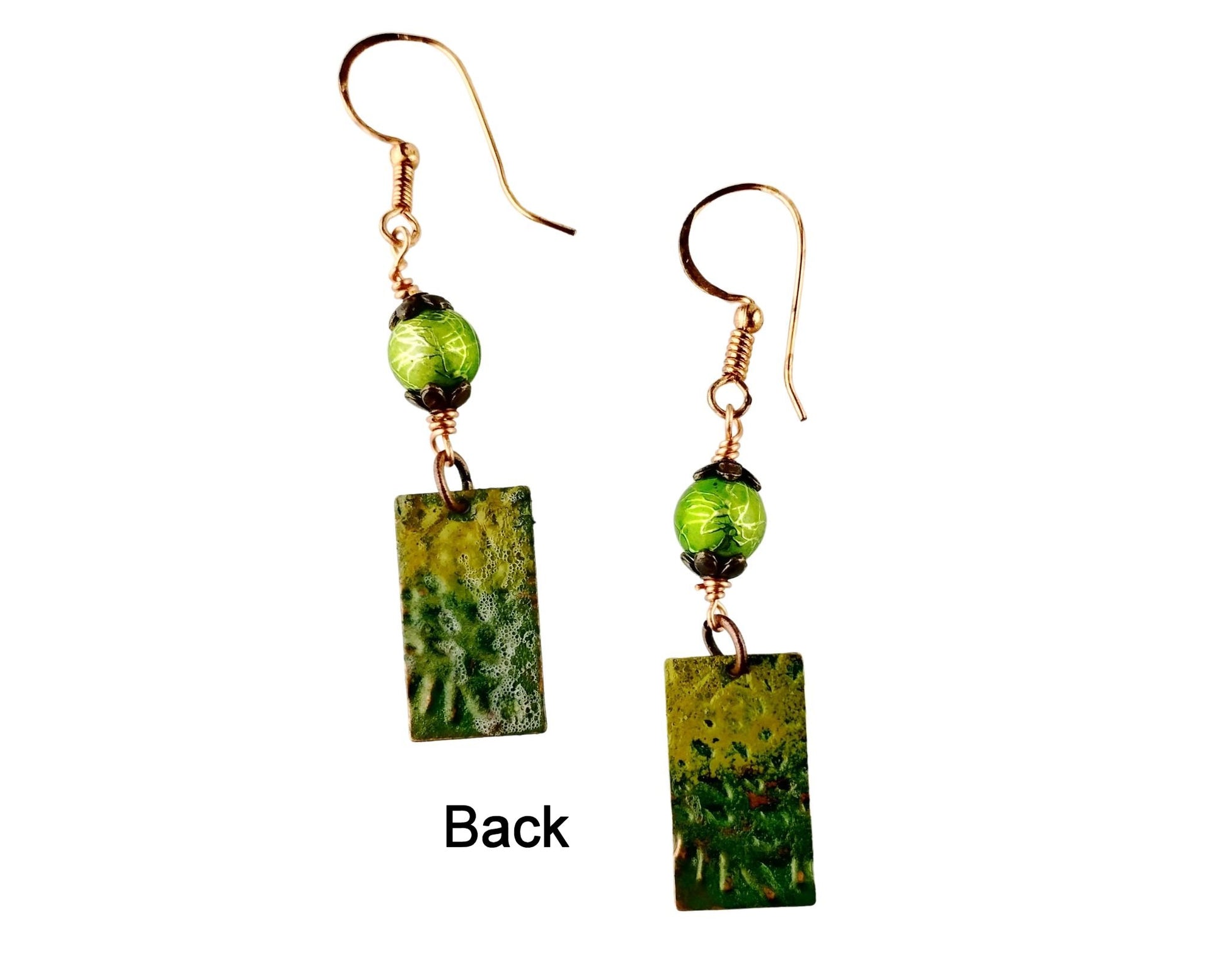 Back of Nature-inspired earrings featuring olive and forest green hand-painted copper and Kelly green beads
