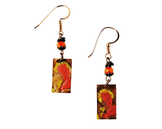 Hand-painted paisley copper earrings in coral orange and yellow