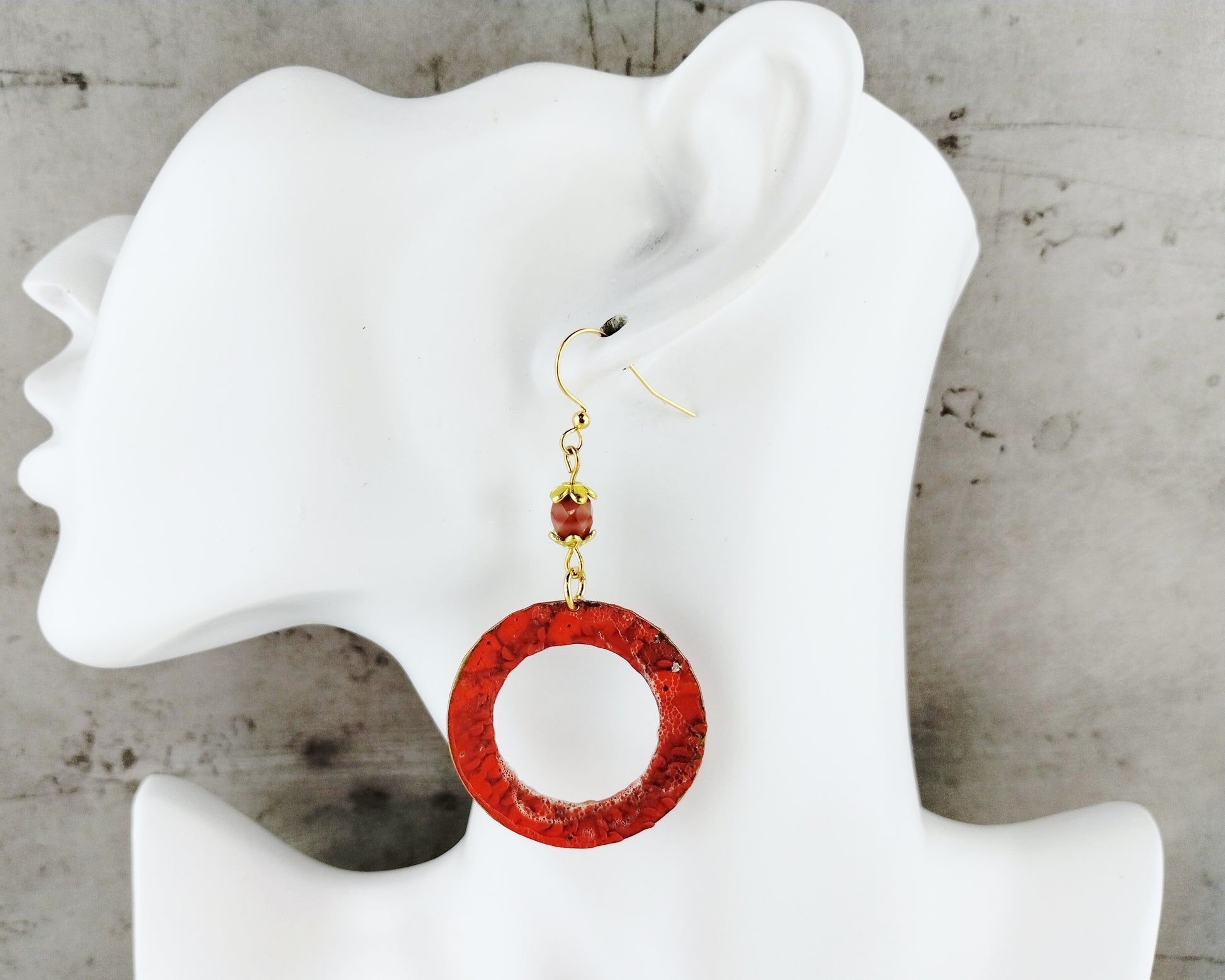 Hand-painted brass hoop earrings in salmon pink with gold-plated details
