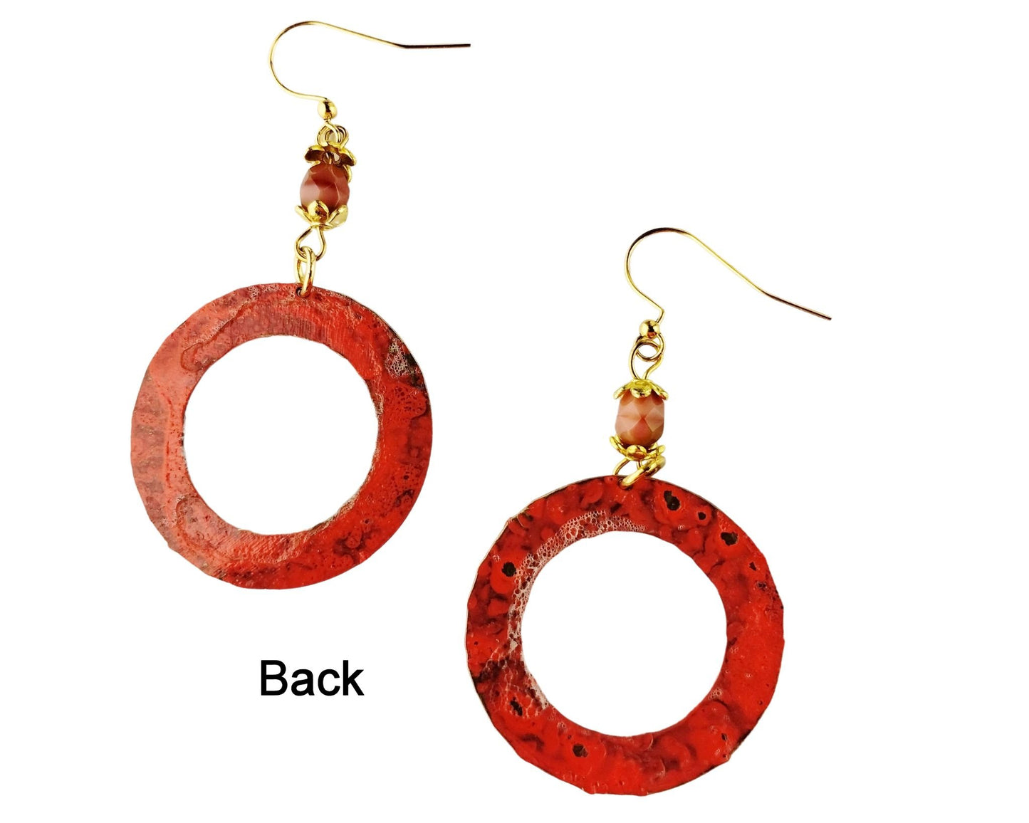 Back of of handmade salmon pink hoop earrings with hammered brass texture and gold-plated accents