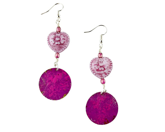 Fuchsia pink glass heart earrings with hidden fairy design