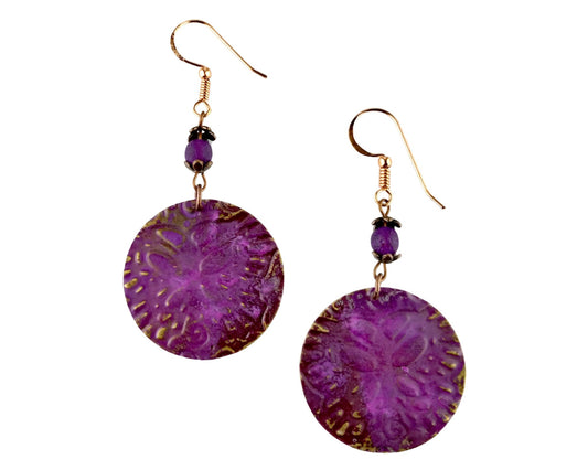 Round brass earrings with butterfly design painted in eggplant purple