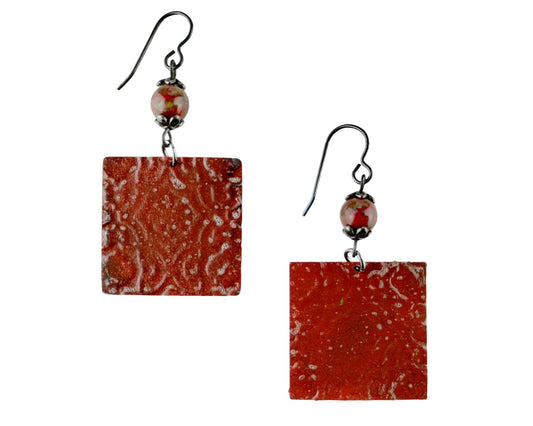 Sangria red glass bead earrings with hand-painted Indian pattern.