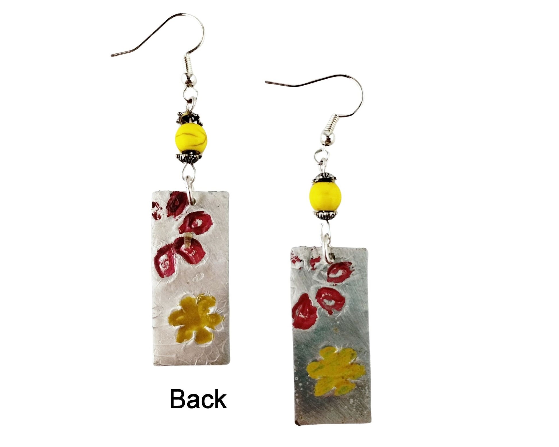 Back of Artistic pewter dangle earrings on silver fishhook wires