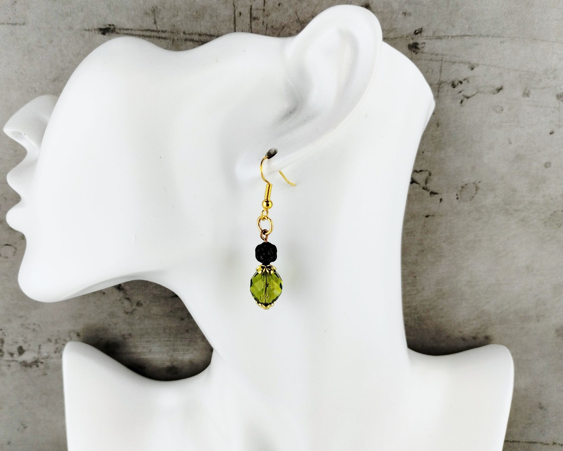 Lightweight drop earrings in earthy green and deep purple, with gold-toned brass findings.