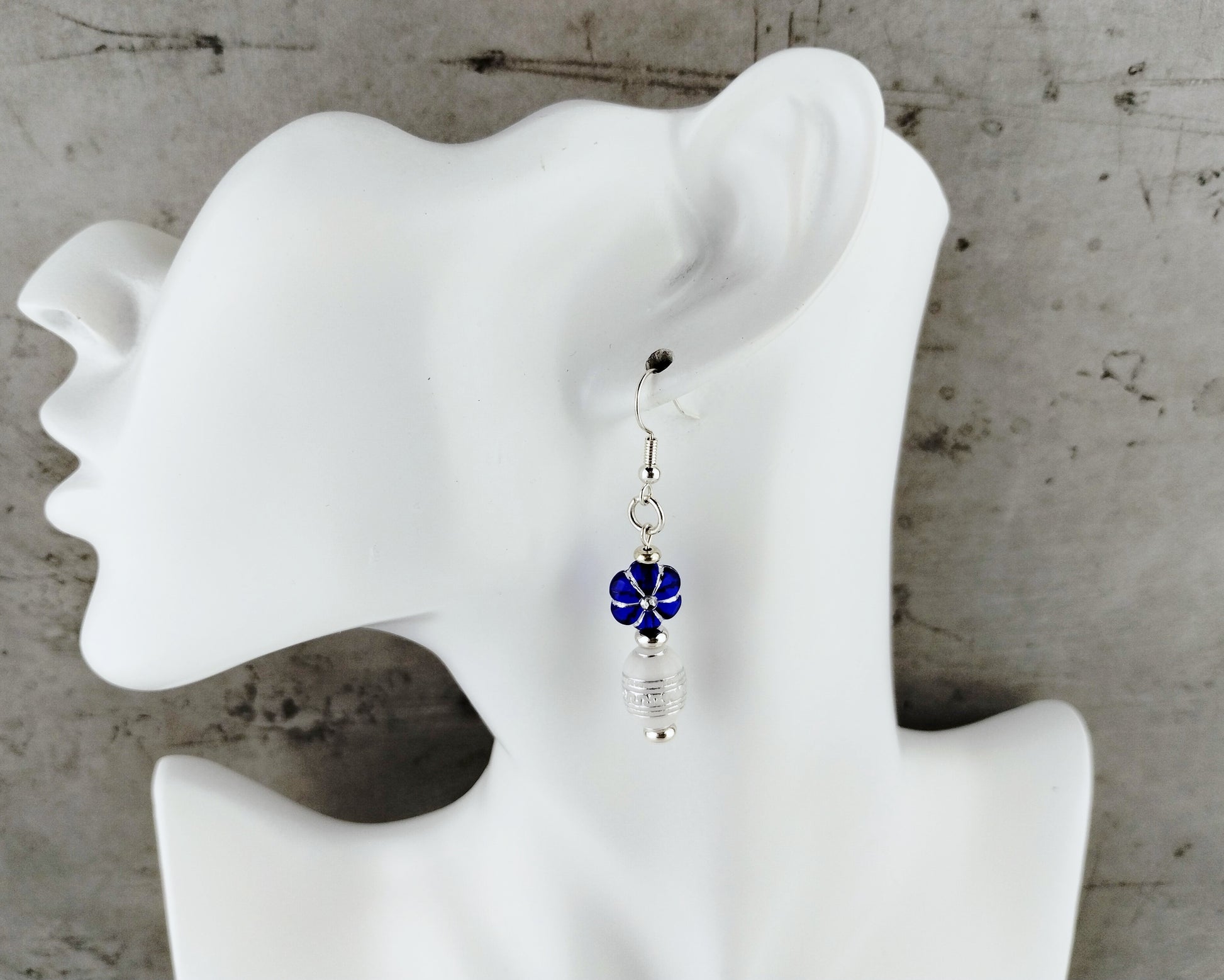 Blue floral rhinestone earrings with silver detailing