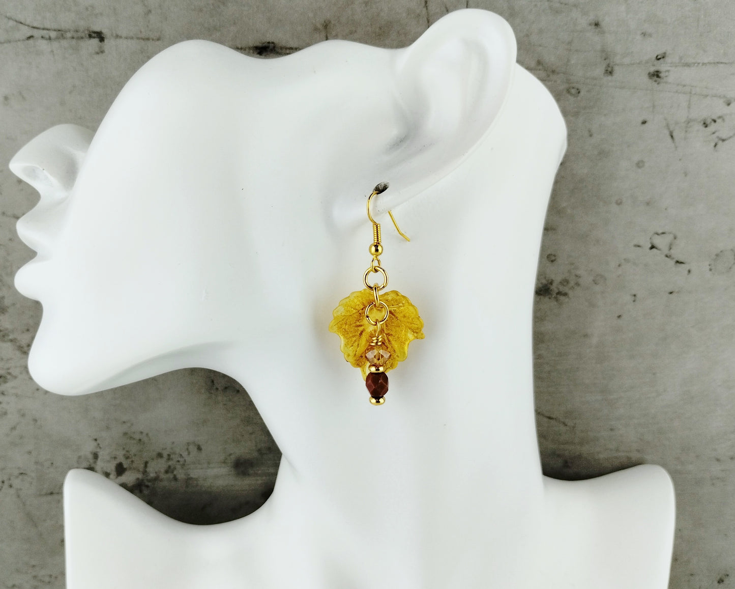 Golden fall earrings with yellow glass bead drops and leaf charms