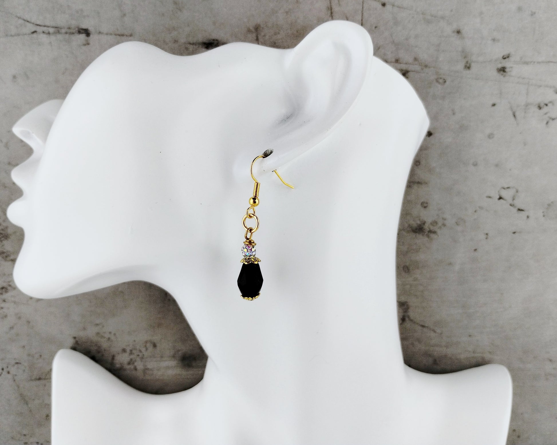 Elegant black drop earrings with vintage-inspired bead caps