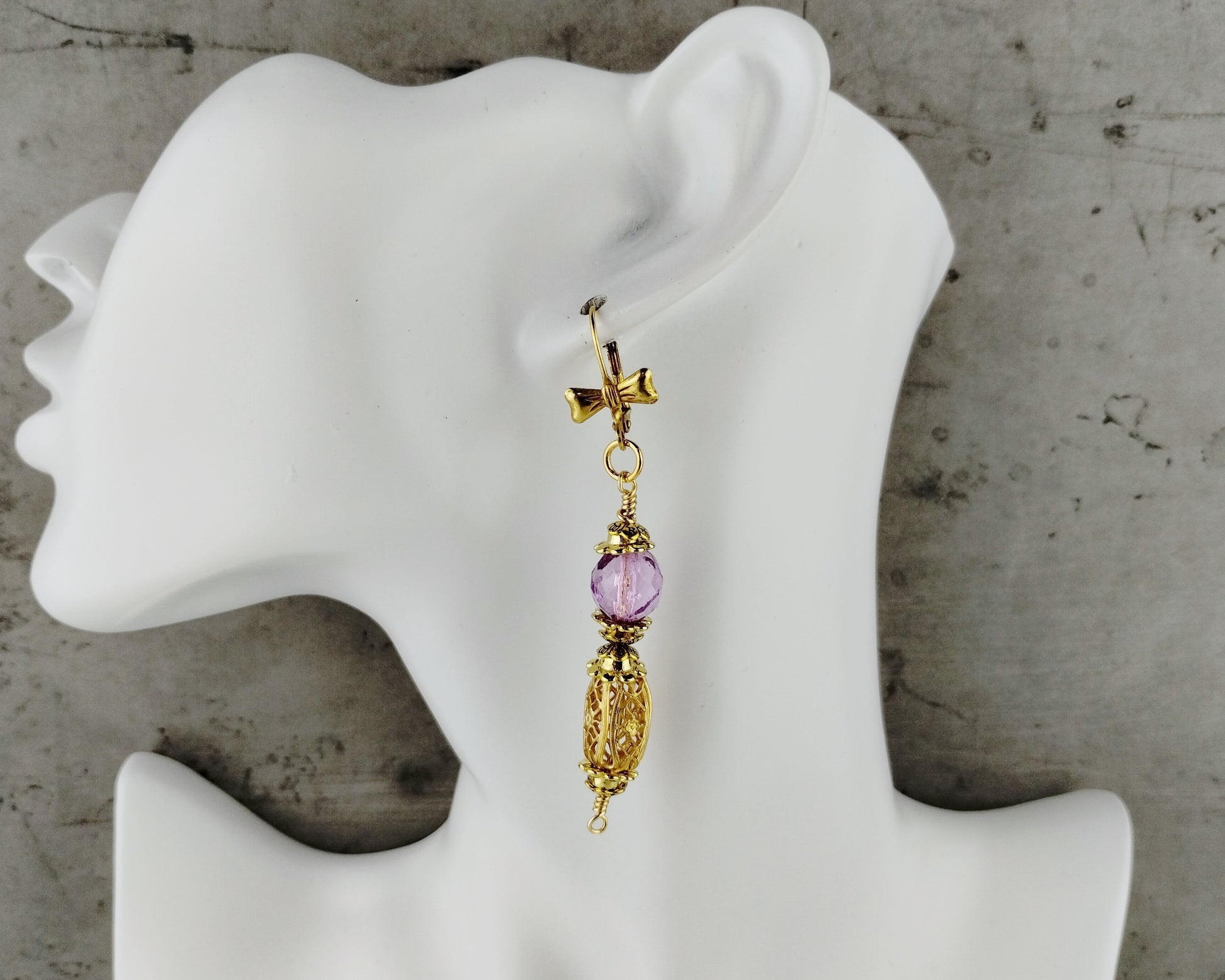 Vintage-inspired earrings with purple beads and gold lever backs