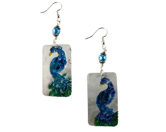 Hand-painted peacock earrings in aquamarine with etched pewter rectangles and glass bead accents