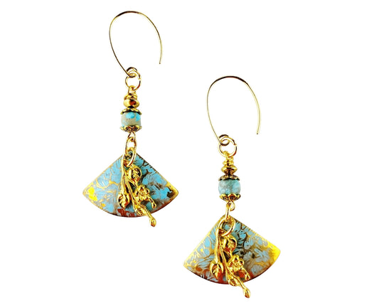 Pair of earrings with turquoise and gold designs on a white background