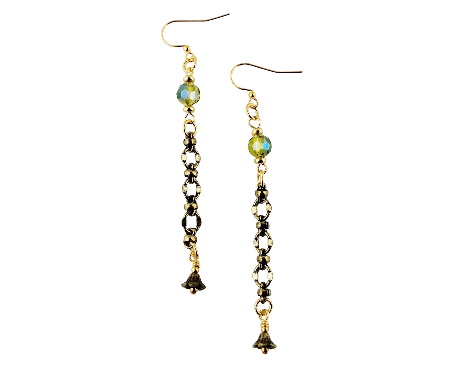 Pair of earrings with beads and small charms on a white background