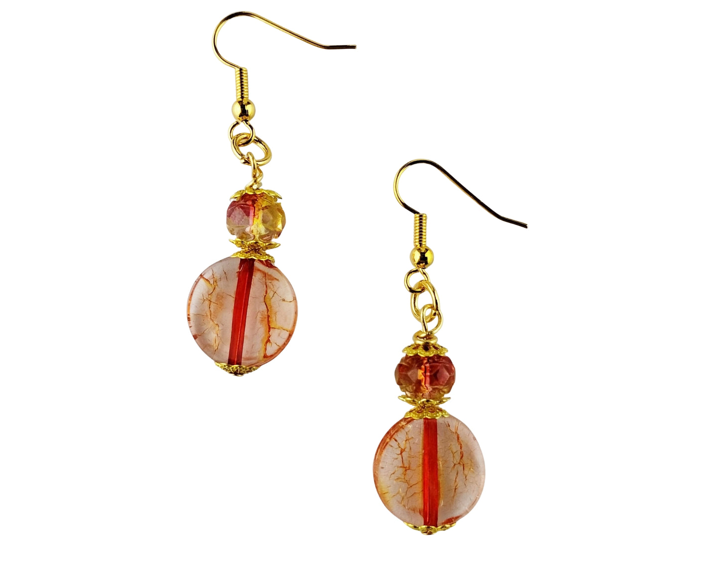 Pair of earrings with orange and gold beads on a white background