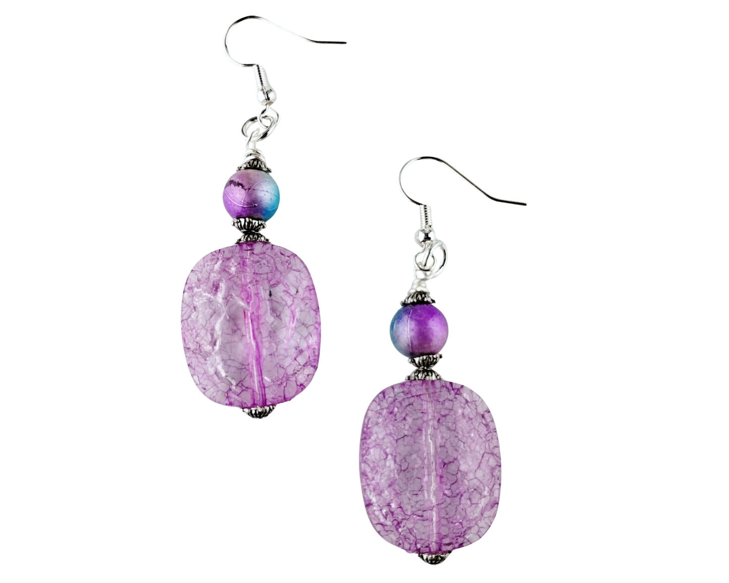 Pair of purple beaded earrings on a white background