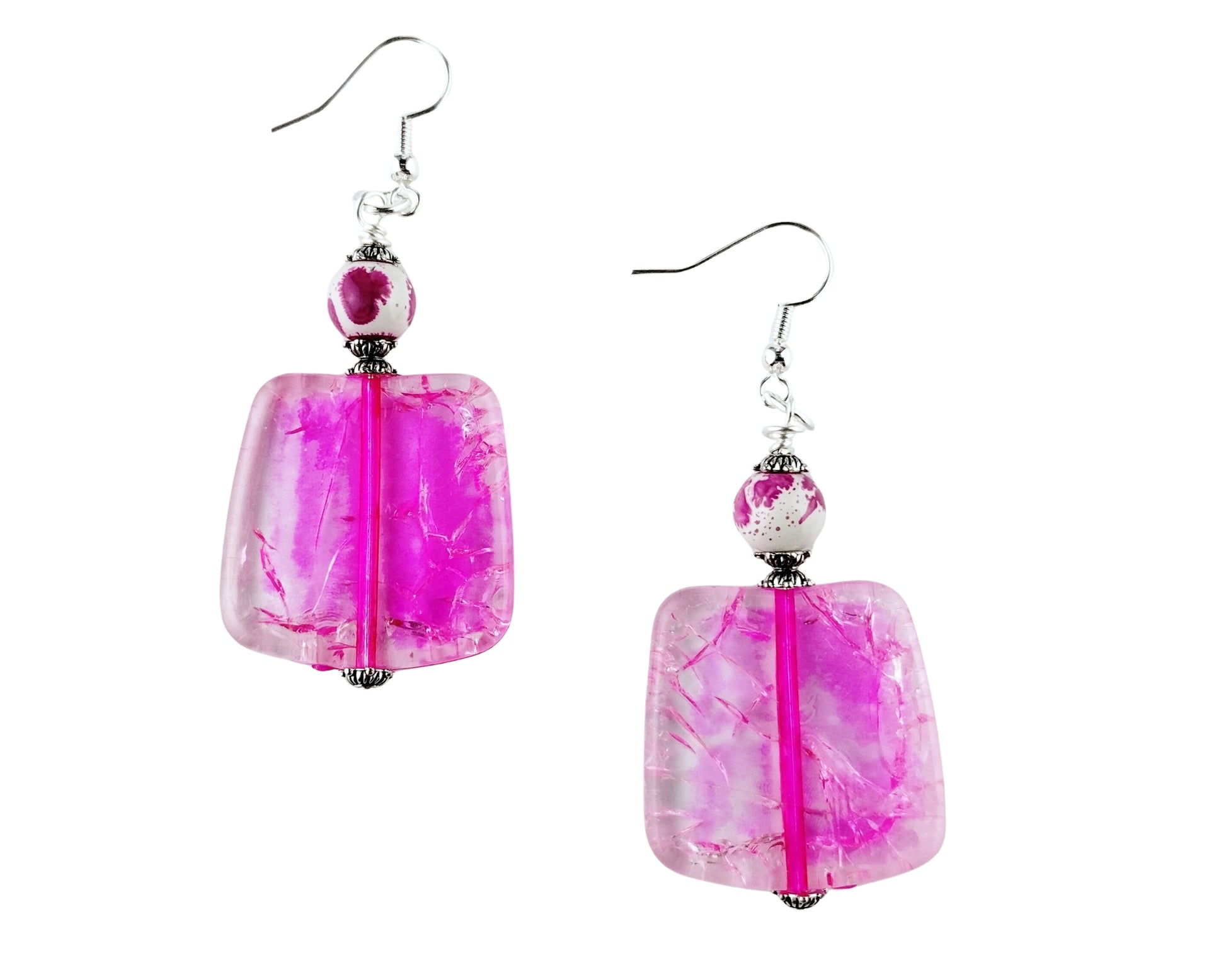 Pink square-shaped earrings with silver hooks on a white background