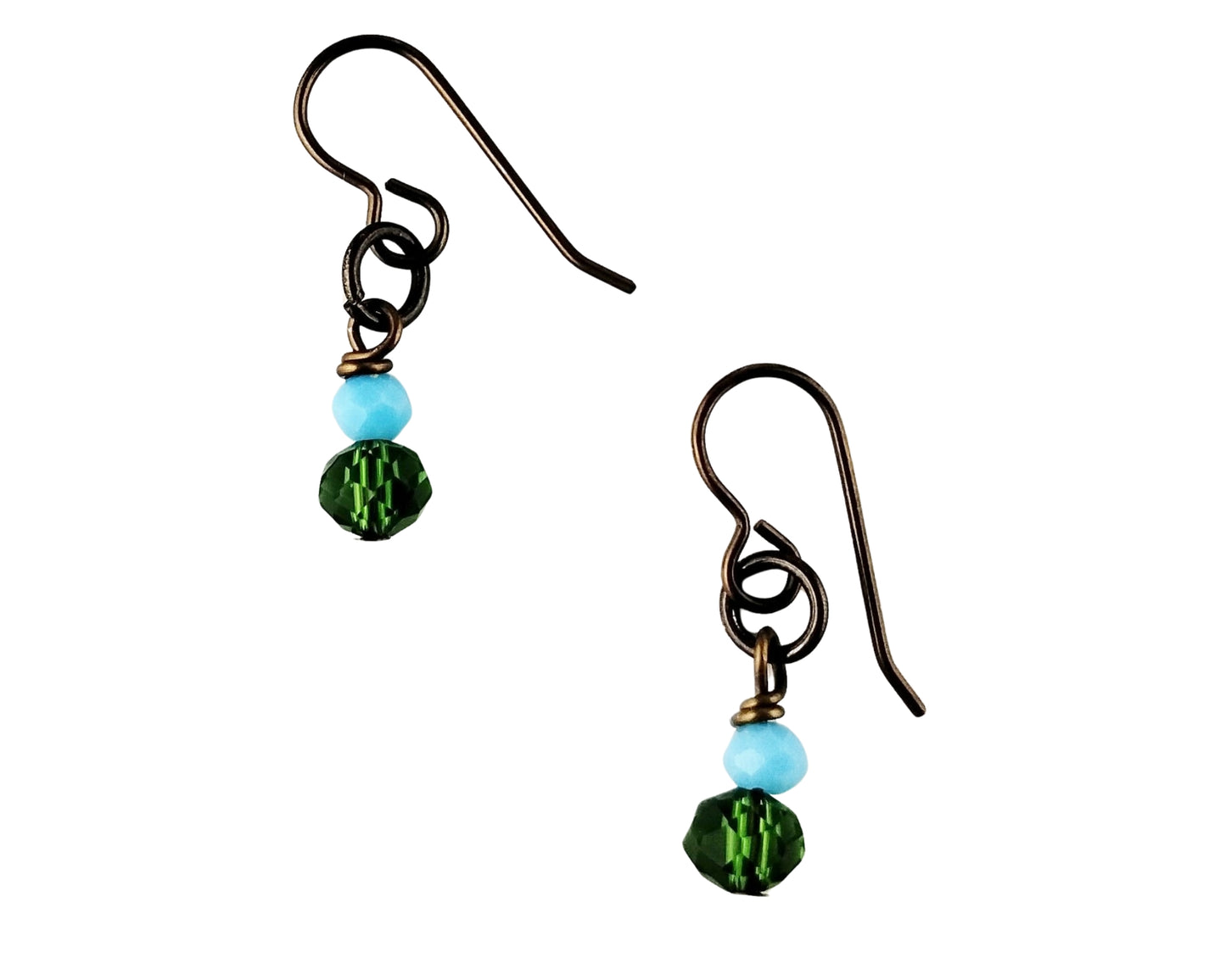 Pair of earrings with green and blue beads on a white background